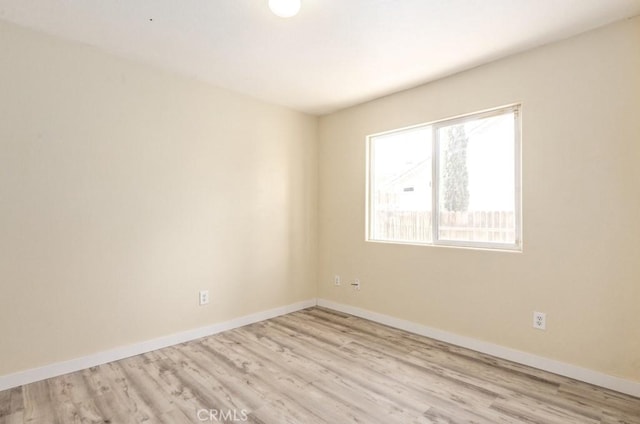 unfurnished room featuring light wood-type flooring