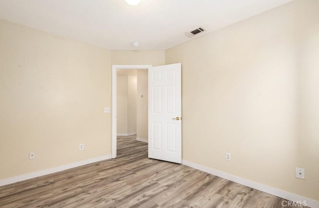 unfurnished room with light hardwood / wood-style flooring