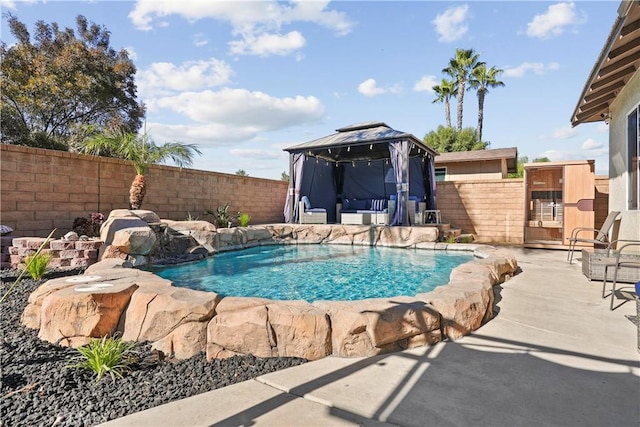 view of swimming pool featuring a gazebo, a patio, and pool water feature