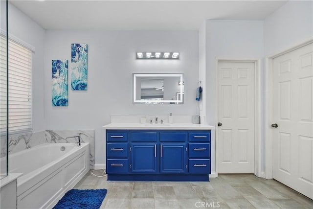 bathroom with a bathtub and vanity