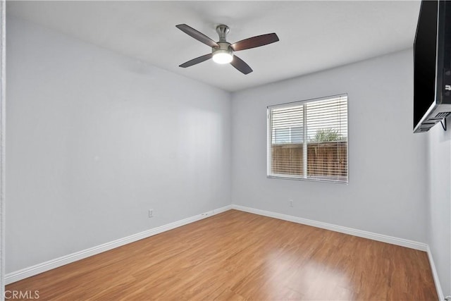 unfurnished room featuring ceiling fan and light hardwood / wood-style floors