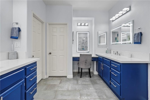 bathroom with tile patterned flooring and vanity