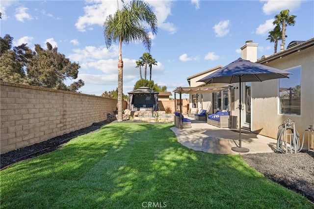 view of yard with a pergola and a patio area