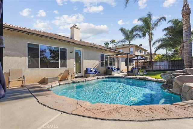 view of pool with pool water feature and a patio area