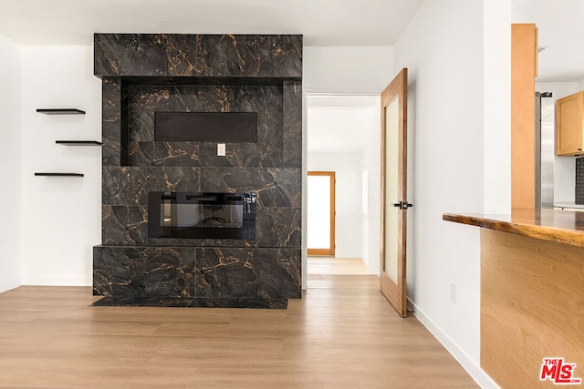 interior details with a fireplace and hardwood / wood-style floors