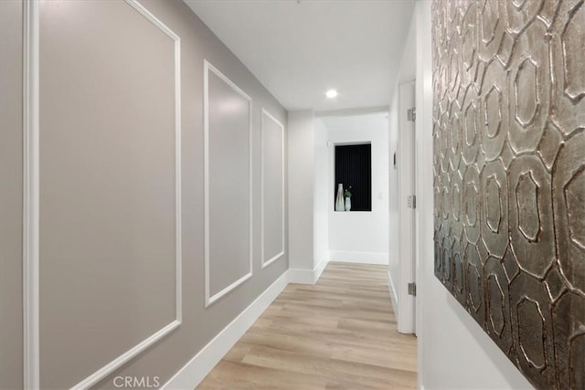 corridor featuring light hardwood / wood-style flooring