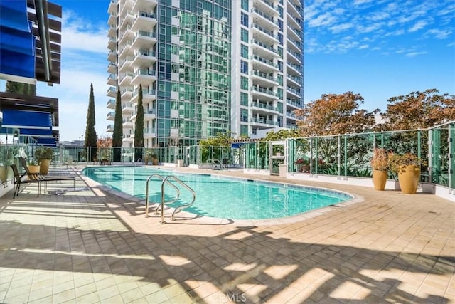 view of pool featuring a patio