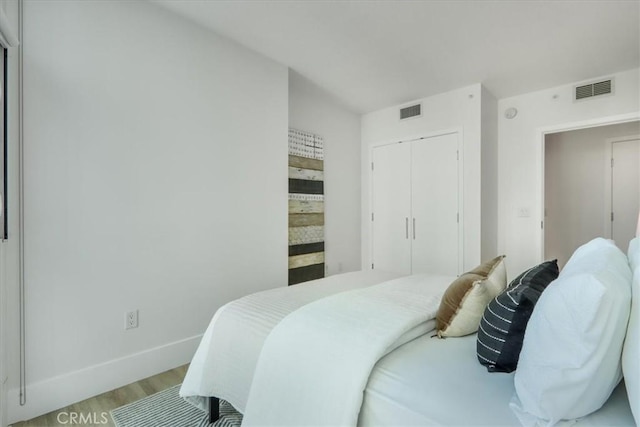 bedroom with a closet and light wood-type flooring