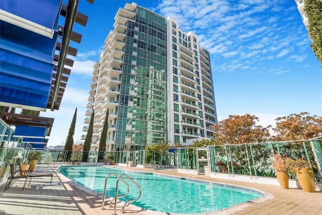 view of swimming pool with a patio