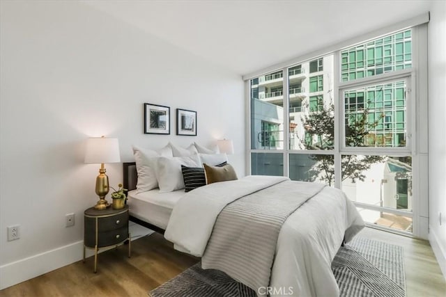 bedroom with wood-type flooring