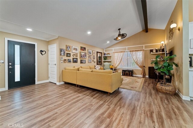 living room featuring hardwood / wood-style flooring and lofted ceiling with beams