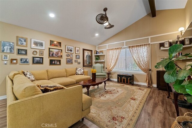 living room featuring vaulted ceiling with beams and wood-type flooring