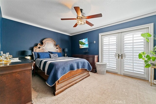 bedroom with ceiling fan, a textured ceiling, and multiple windows