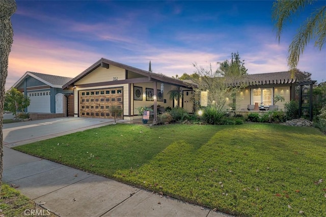 single story home featuring a yard and a garage