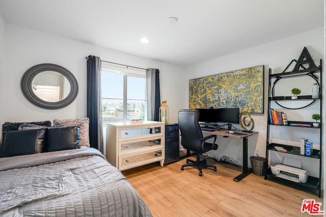 bedroom featuring light wood-type flooring