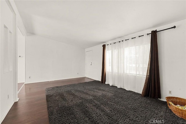 spare room featuring dark hardwood / wood-style floors