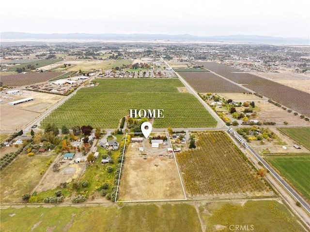 birds eye view of property with a rural view