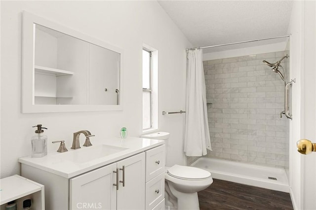 bathroom with a shower with curtain, vanity, toilet, and wood-type flooring