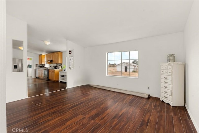 unfurnished living room featuring dark hardwood / wood-style floors