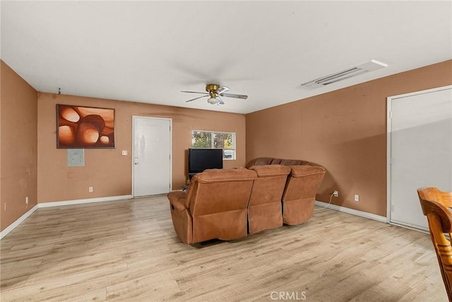 living room featuring ceiling fan and light wood-type flooring