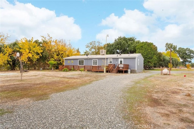 manufactured / mobile home with a wooden deck