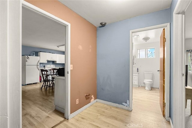 doorway to outside with light wood-type flooring