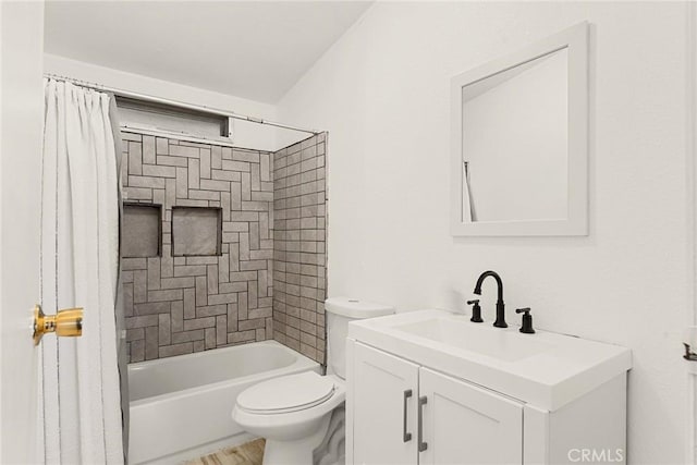 full bathroom with vanity, toilet, and tiled shower / bath