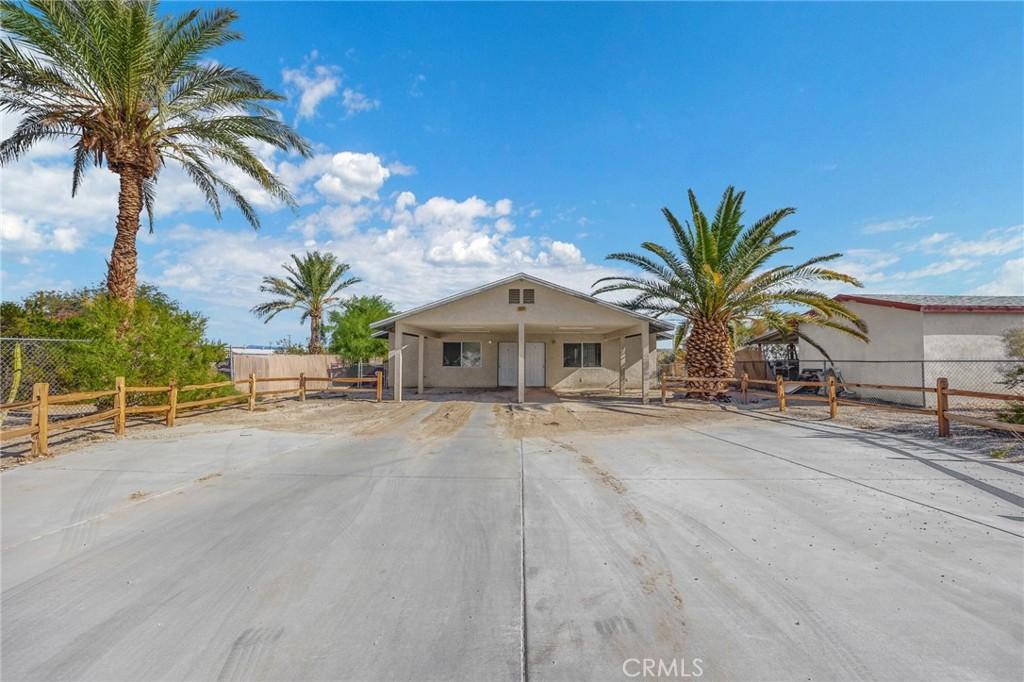 view of front of home featuring a carport