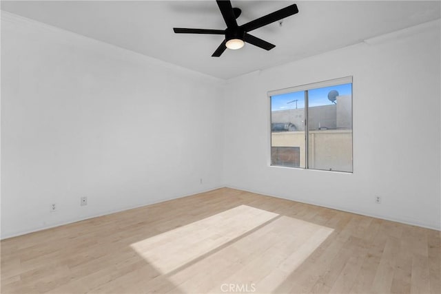 unfurnished room featuring ceiling fan and light hardwood / wood-style flooring