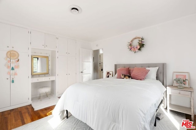 bedroom featuring wood-type flooring