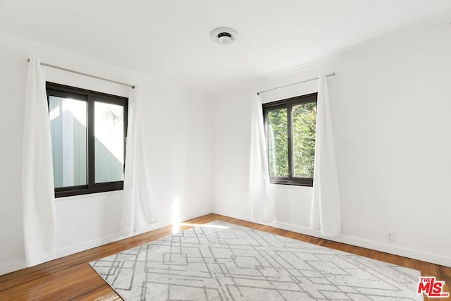 empty room featuring hardwood / wood-style flooring