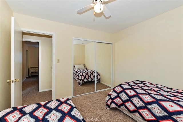 bedroom with carpet, a closet, and ceiling fan