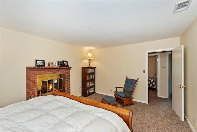 carpeted bedroom featuring a brick fireplace