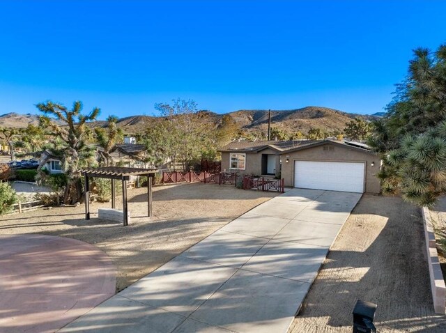 view of front of house with a mountain view and a garage