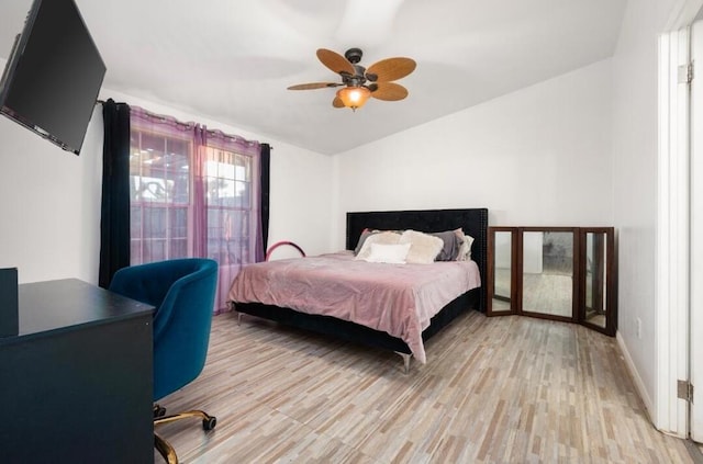 bedroom with ceiling fan and light hardwood / wood-style floors