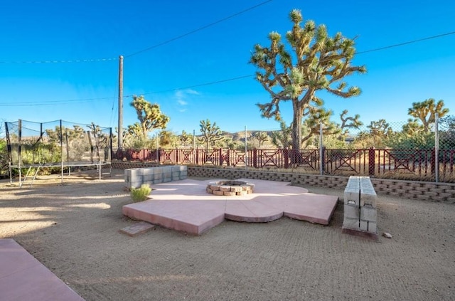 view of patio / terrace with a fire pit