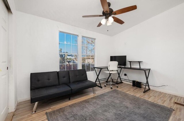 office space with ceiling fan and hardwood / wood-style flooring