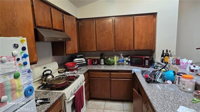 kitchen with white appliances and light tile patterned flooring