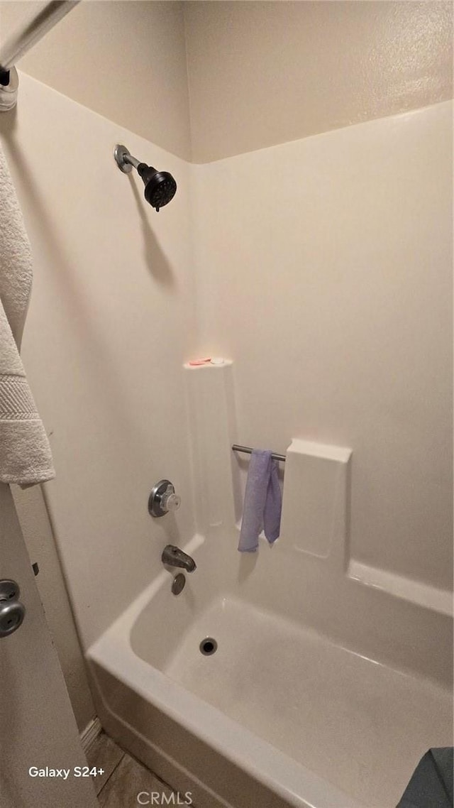 bathroom with shower / bath combination