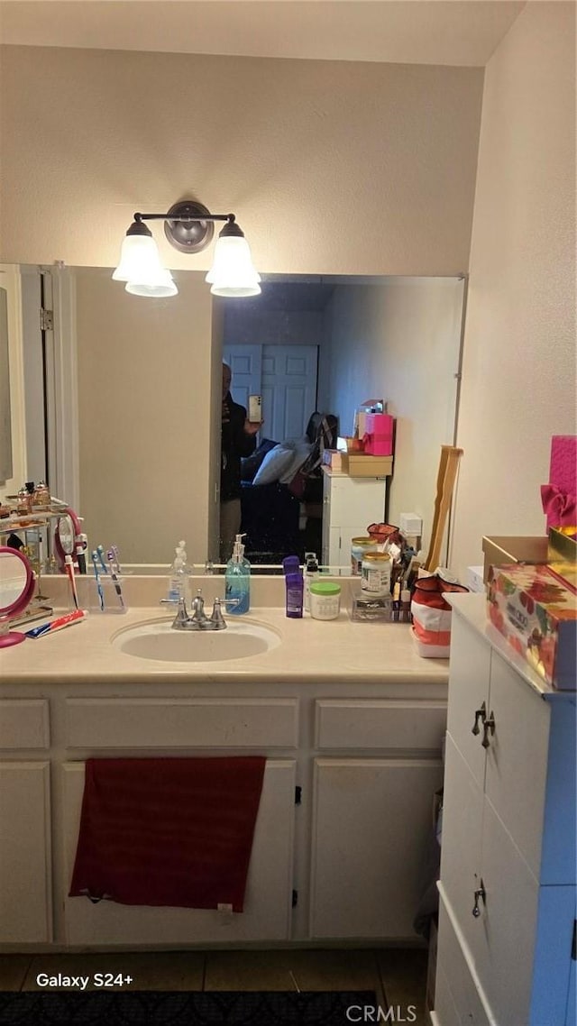 bathroom with tile patterned floors and vanity