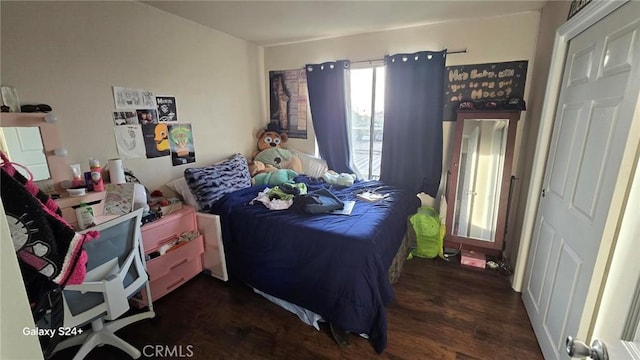 bedroom featuring dark wood-type flooring