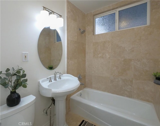 bathroom with toilet and  shower combination