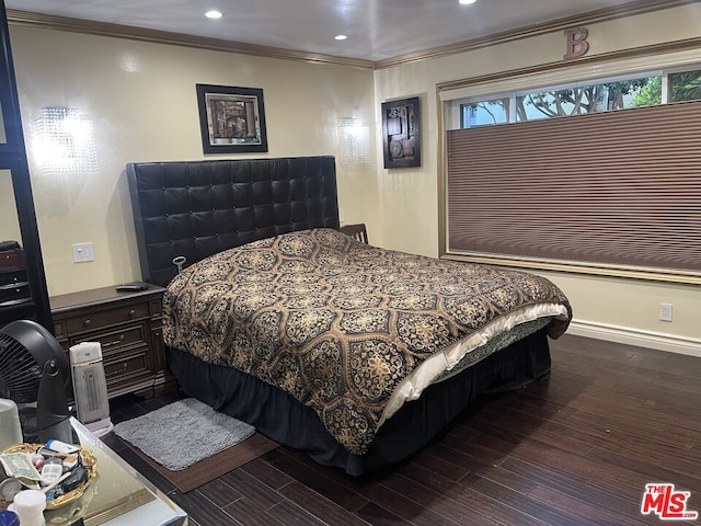 bedroom featuring dark hardwood / wood-style flooring and ornamental molding