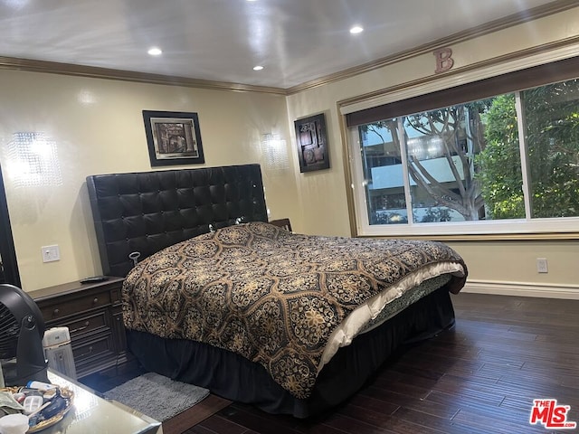 bedroom with a baseboard radiator, dark hardwood / wood-style floors, and ornamental molding