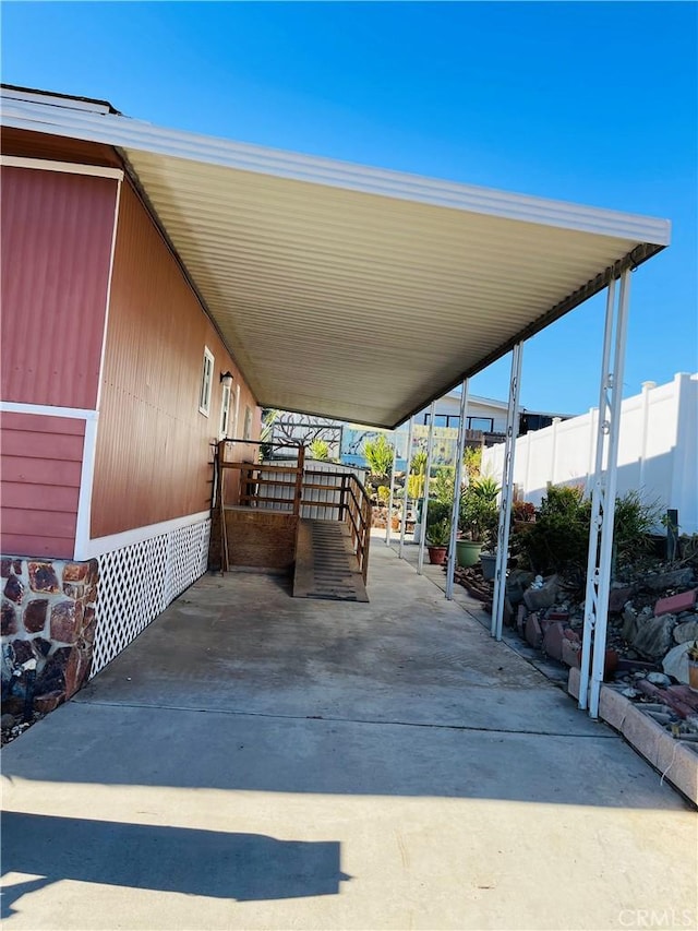 view of parking / parking lot with a carport