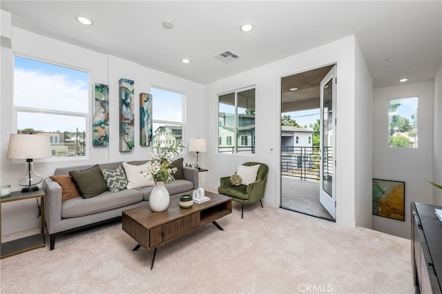 carpeted living room featuring a healthy amount of sunlight