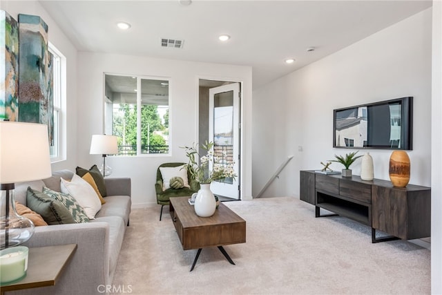 living room with light colored carpet