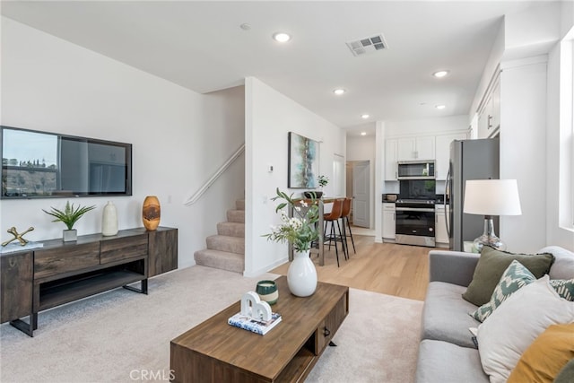 living room with light hardwood / wood-style flooring