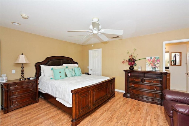 bedroom with ceiling fan and light hardwood / wood-style floors