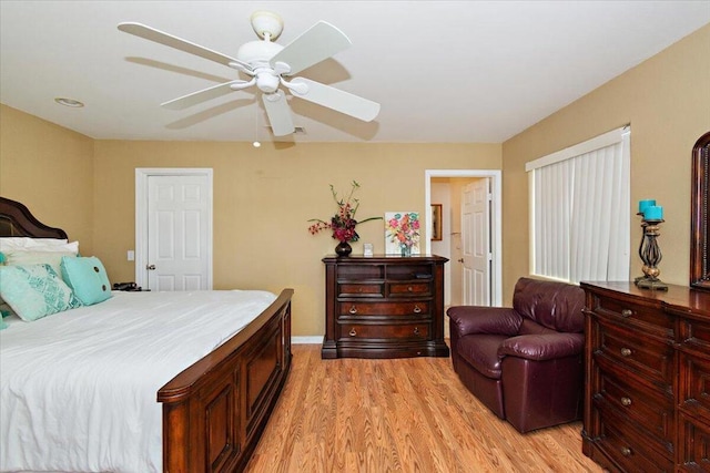 bedroom with light wood-type flooring and ceiling fan